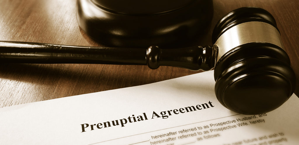 prenuptial agreements papers next to gavel