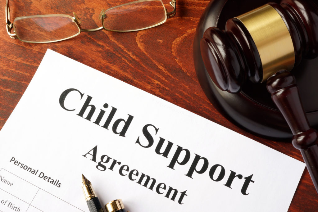 Child support payment agreement on an office table.