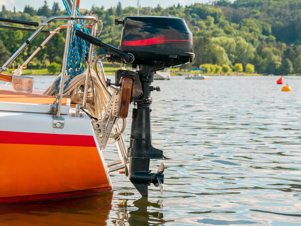 boat motor out of water on lake