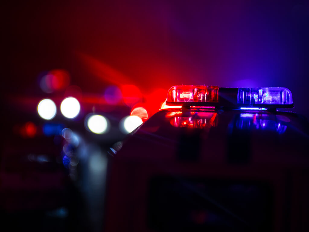 flashing police car lights at night